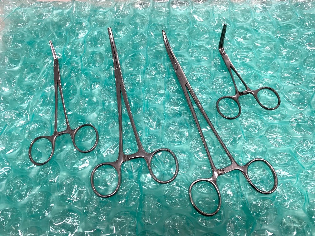 QTY. 4 - Curved Surgical Forceps
